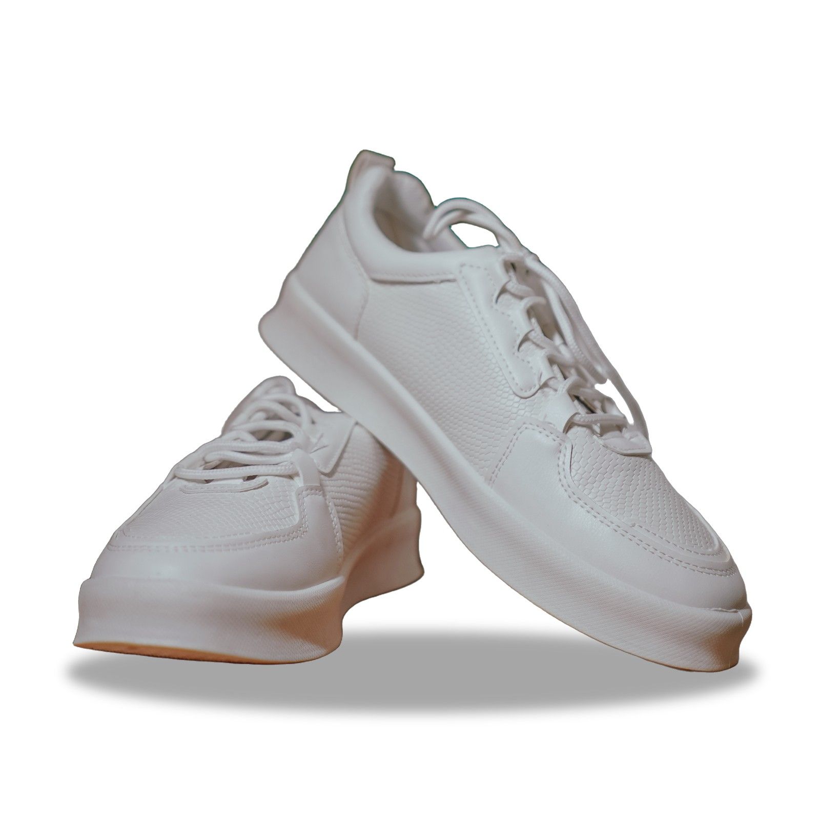 The same white sneakers on a pure white background with a soft contact shadow